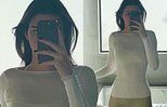 Kendall Jenner shows off her sculpted physique wearing a fitted white top and ... trends now