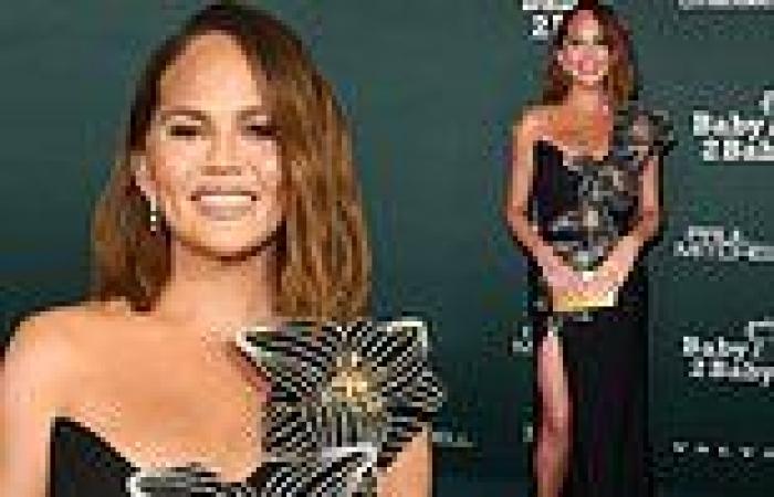 Chrissy Teigen shows off her legs in a stunning black gown with a 3D floral ... trends now