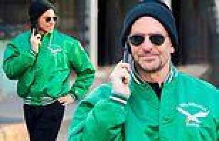 Bradley Cooper stands out in a bright green Philadelphia Eagles jacket while ... trends now