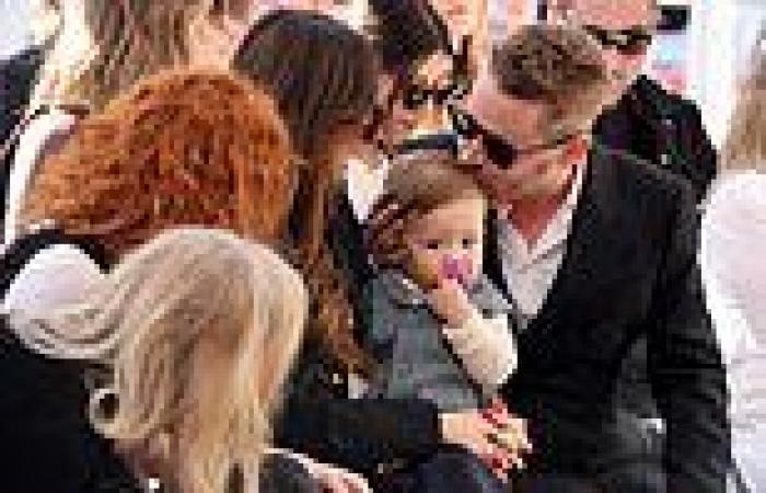 Macauley Culkin plants a sweet kiss on son's head as he attends Hollywood Walk ... trends now