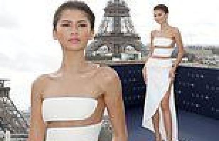 Zendaya shows off her toned figure in a white cut-out gown with a thigh-high ... trends now