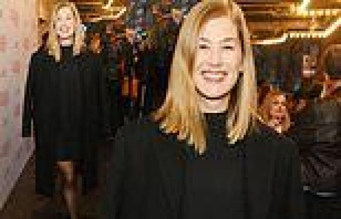 Rosamund Pike puts on a leggy display in a black dress and sheer tights as she ... trends now