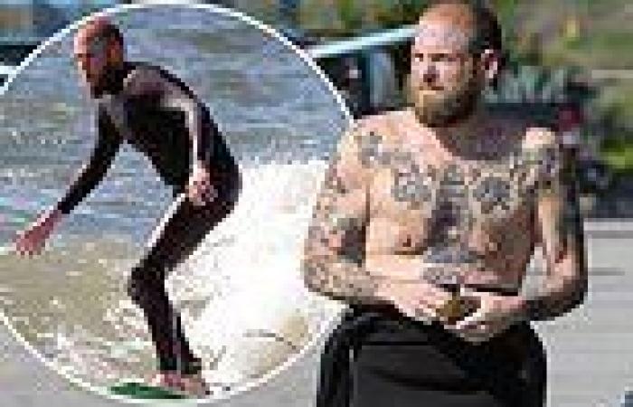 Jonah Hill flashes his extensive tattoos in a wetsuit while enjoying a day of ... trends now