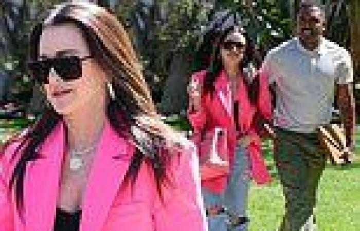 Kyle Richards cuts a stylish figure in a hot pink blazer and ripped jeans as ... trends now