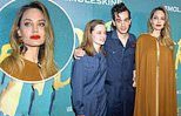 Angelina Jolie looks incredible in metallic gown and rust-hued cape as she ... trends now