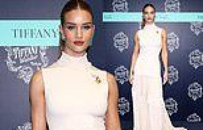 Rosie Huntington-Whiteley is the epitome of chic in a sleeveless white gown as ... trends now