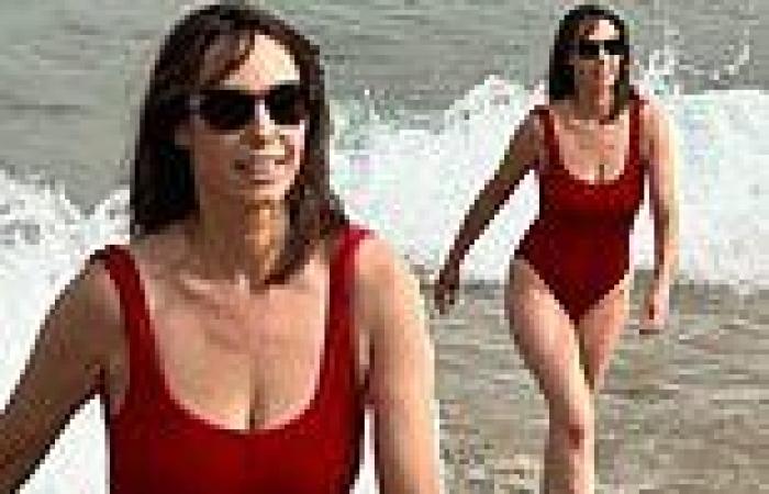 Alex Jones, 47, channels her inner Baywatch lifeguard in a red swimsuit during ... trends now