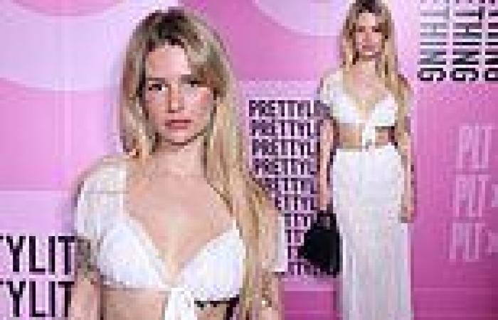 Lottie Moss flashes her toned midriff in a plunging bra top and sheer skirt as ... trends now