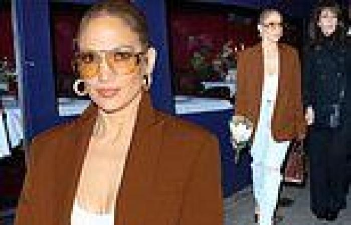 Jennifer Lopez, 54, teases her cleavage in a low-cut white shirt and brown ... trends now