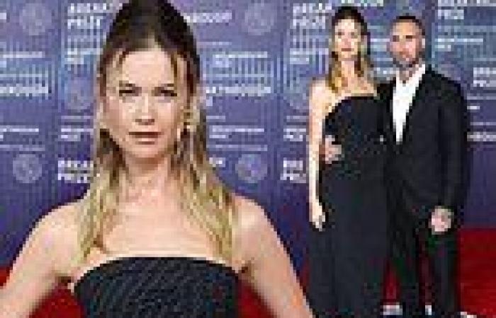 Behati Prinsloo dazzles in strapless pinstriped gown while Adam Levine ...