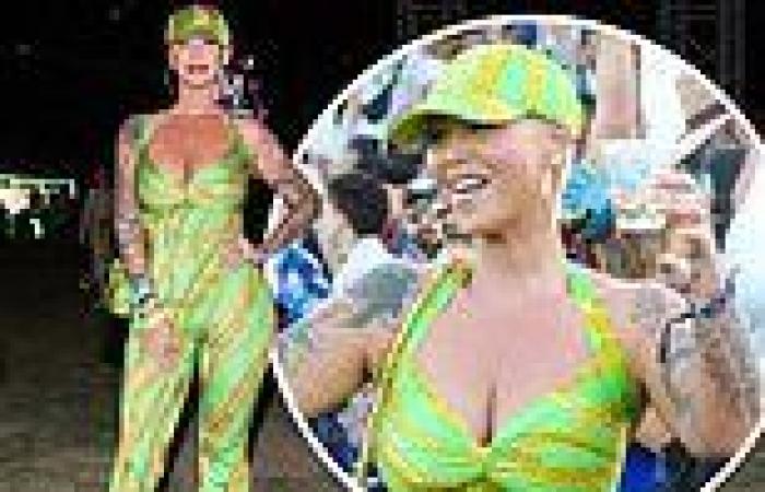 Amber Rose stands out in bright green jumpsuit with plunging neckline while ... trends now