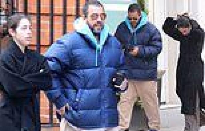 Adam Sandler bundles up in a blue padded jacket as he steps out for a ... trends now