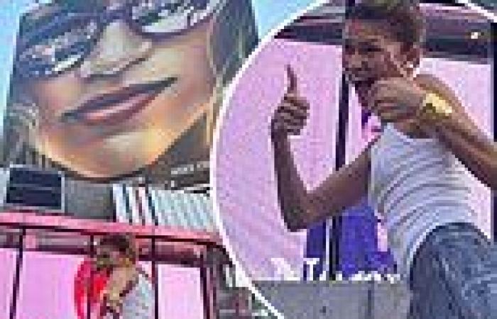 Zendaya gives two thumbs up while striking poses in front of giant billboard ... trends now