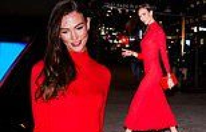 Karlie Kloss exudes confidence in a bold red midaxi dress as she attends ... trends now