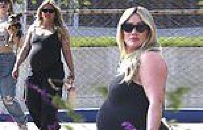 Hilary Duff shows off her growing baby bump in a sleeveless black dress as she ... trends now