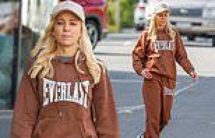 She's just like us! Carrie Bickmore, 43, looks cosy as she steps out in a brown ... trends now