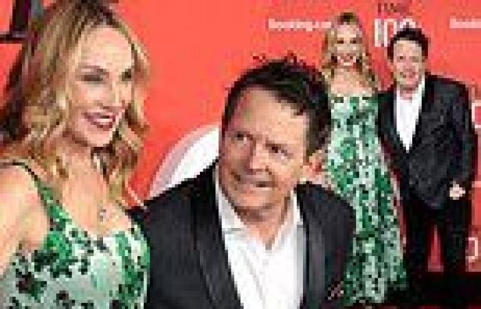 Michael J. Fox gazes adoringly at wife Tracy Pollan on red carpet before being ... trends now