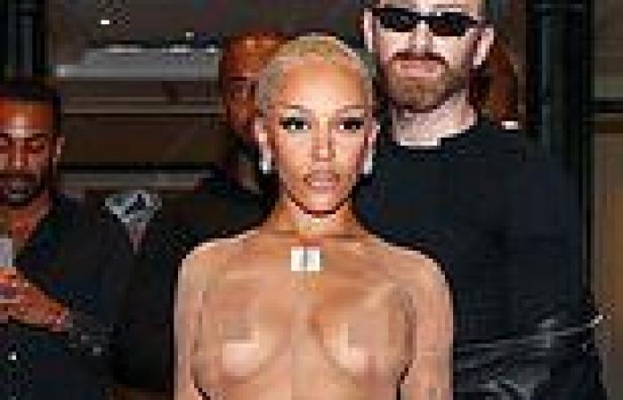 Doja Cat goes braless in a completely see-through nude crop top and tights (her ... trends now