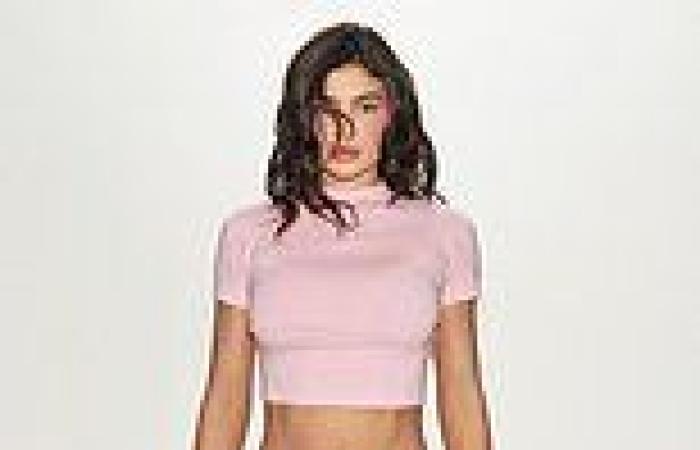 Kylie Jenner flashes her toned tummy as she introduces her new colorful Khy ... trends now