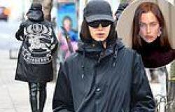 Irina Shayk models a coat with a HUGE Burberry logo on the back trends now