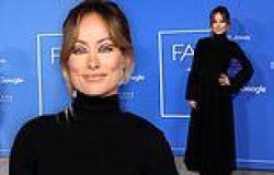 Olivia Wilde looks elegant in a black gown and platform boots at Fashion Trust ... trends now