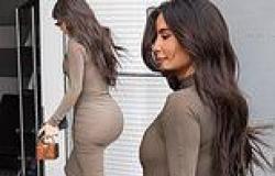 Kim Kardashian highlights her famous backside in a skintight dress as she jets ... trends now