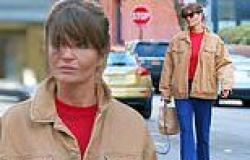 Helena Christensen keeps it casual in an oversized jacket and jeans while ... trends now