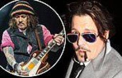 Johnny Depp sports a smart suit as he puffs on a cigarette in Mayfair after ... trends now