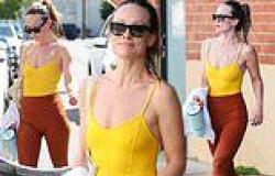 Olivia Wilde put on a perky display in a bright yellow tank top as she exits ... trends now