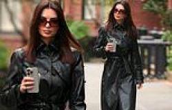 Emily Ratajkowski covers up in a stylish black trench coat in New York City... ... trends now