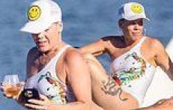 Pink, 44, shows off her toned figure in a stylish white swimsuit during family ... trends now
