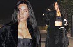 Kim Kardashian shows off her sculpted figure in a skimpy bandeau top and fuzzy ... trends now