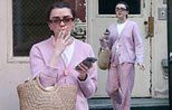Maisie Williams puffs on a cigarette as she steps out in striped PJ bottoms and ... trends now