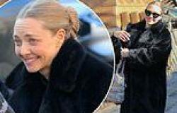 Amanda Seyfried stays warm by layering up in a black fur coat between takes on ... trends now