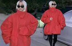 Kim Kardashian dons a stylish oversized red coat and shows off her new blonde ... trends now