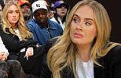 Adele looks stunning in chic black and white ensemble as she sits courtside ... trends now