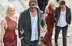 Chris Hemsworth shows off his chivalrous side as he offers his arm to support ... trends now