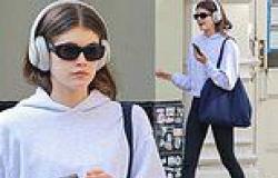 Kaia Gerber cuts a very sporty figure in a hoodie and leggings as she goes for ... trends now