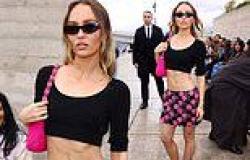 Lily-Rose Depp flaunts her washboard abs in a black crop top and pink mini ... trends now