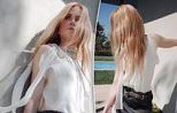 Nicole Kidman shows off her model figure in a flowing blouse and mini skirt as ... trends now
