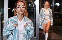 Rita Ora puts on a risqué display in white pants underneath a blue tartan coat ... trends now