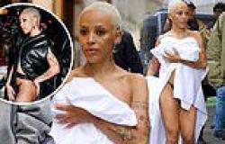 Doja Cat's just rolled out of bed! Rapper shocks by wearing just linen SHEET ... trends now