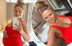 Pregnant Emily Atack proudly cradles her blossoming baby bump in a striking red ... trends now