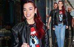 Dua Lipa looks edgy in a biker jacket and blue denim jeans as she arrives in ... trends now