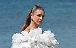 Zara McDermott exudes elegance in a dramatic white frilled gown as she poses ... trends now