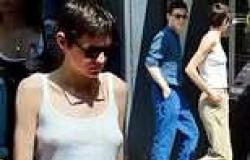 Emma Corrin, 28, cuts a casual figure in a white tank top and slacks on ... trends now