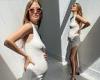 Pregnant Millie Mackintosh showcases her baby bump in a white midi dress