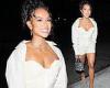 Karrueche Tran flaunts her cleavage and toned legs in low-cut white corset top ...