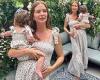 Pregnant Millie Mackintosh showcases baby bump in rose midi dress while holding ...