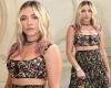 Florence Pugh flashes her toned midriff in a floral crop top and midi skirt